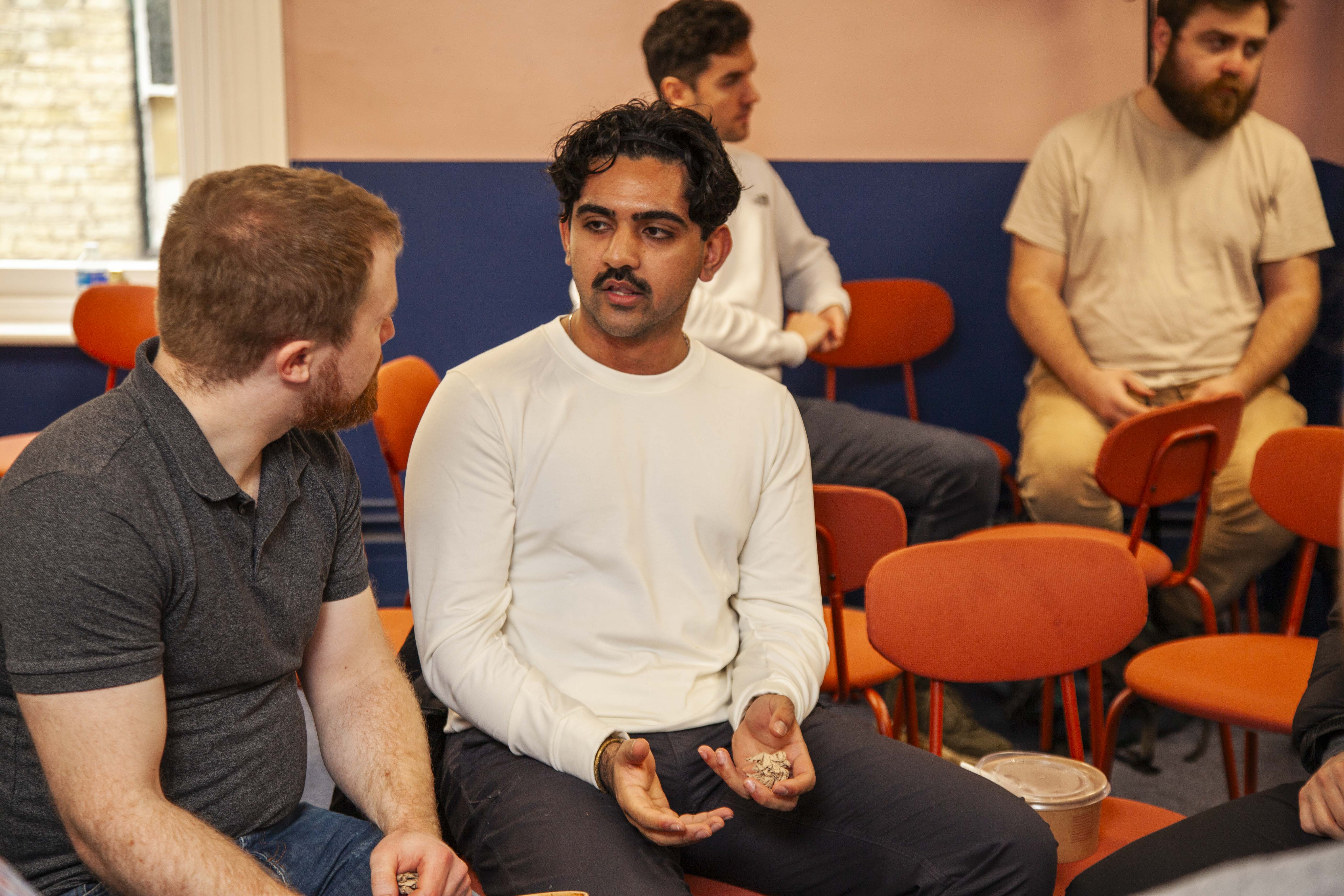 People in conversation in the Meridian event space